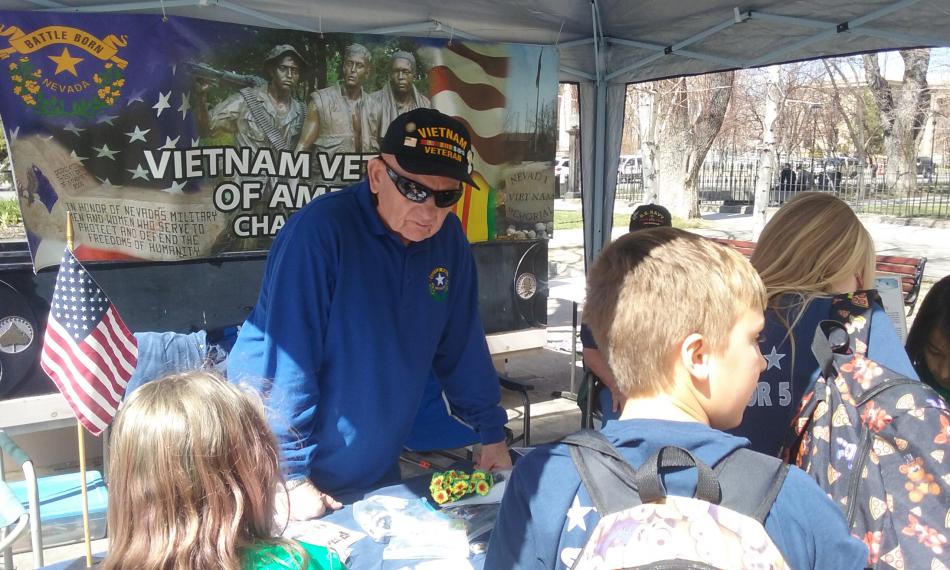 Children listen to a Vietnam War veteran Wednesday on the Capitol Plaza.