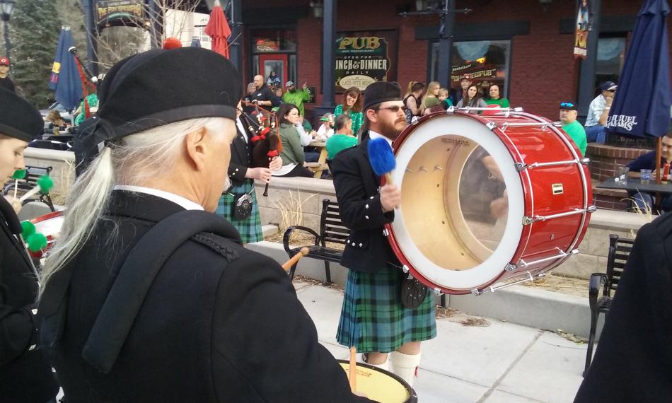 Drums played with bagpipes on McFadden Plaza in front of The Fox Brew Pub.