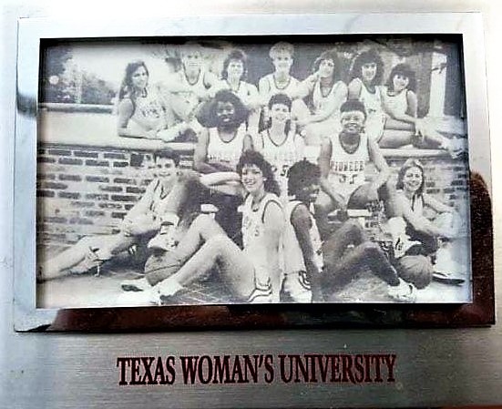 Amy Kimm in a team photo for Texas Woman's University.