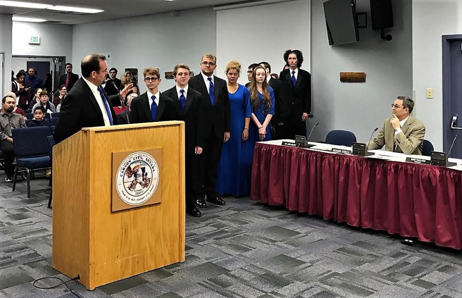 CHS Teacher Andrew Sonnemaker and music students at a CCSD board meeting.