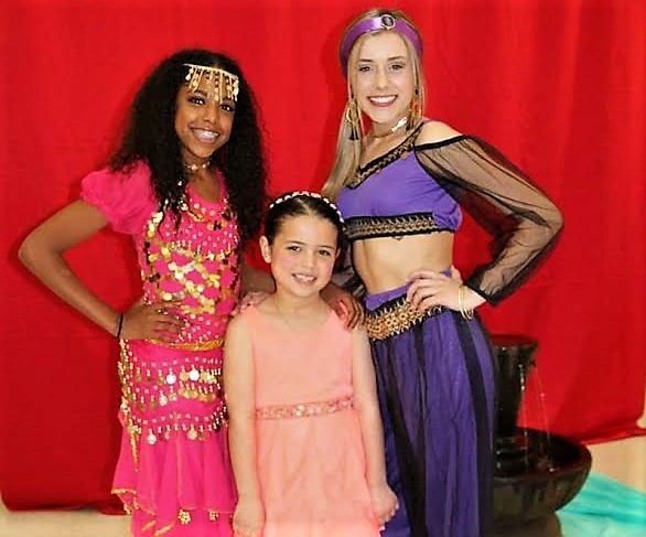 Photos courtesy CHS. Francesca Quintana (left) and Abby Golik pose as princesses with Maya McMillen.