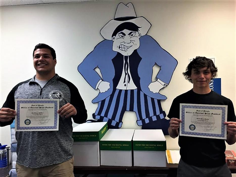 Brandon Basa (left) and Sheldon Miller with their recognition certificates from Gov. Sandoval.