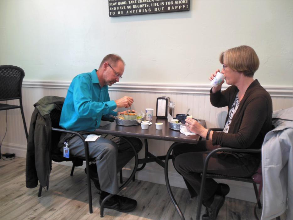 Mike Bish and Lucy Adams enjoy their meal Tuesday at Scoup's.