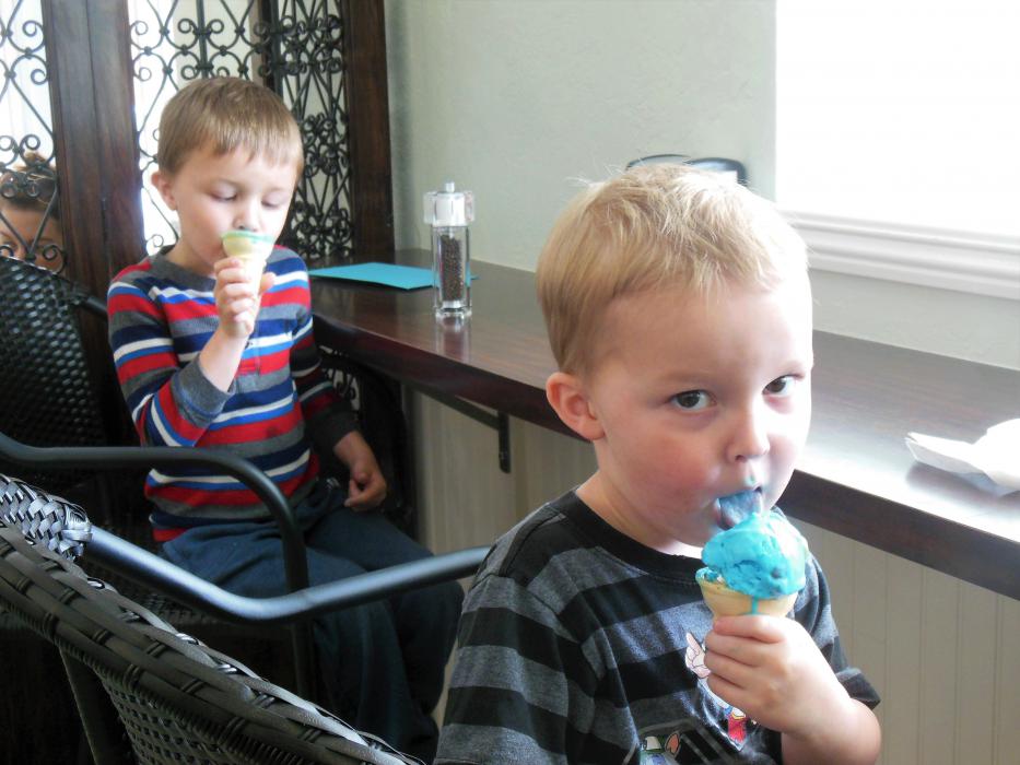 Photos by Brett Fisher. Augustus and Abraham Noll of Carson City enjoy ice cream Tuesday at Scoup's.