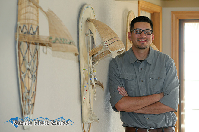 Artist Topah Spoonhunter poses with family cradleboards at his Big Pine, Calif., home. Cathleen Allison, Nevada Photo Source