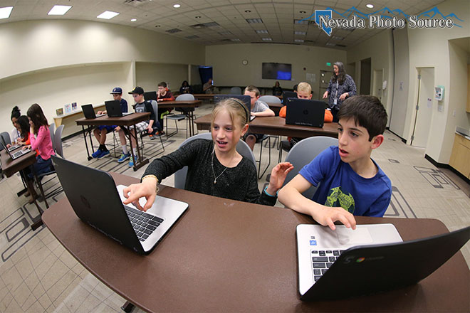 Adi and Amit Orenstein, both 10, work in a coding class at South Valleys Library in Reno. Cathleen Allison, Nevada Photo Source
