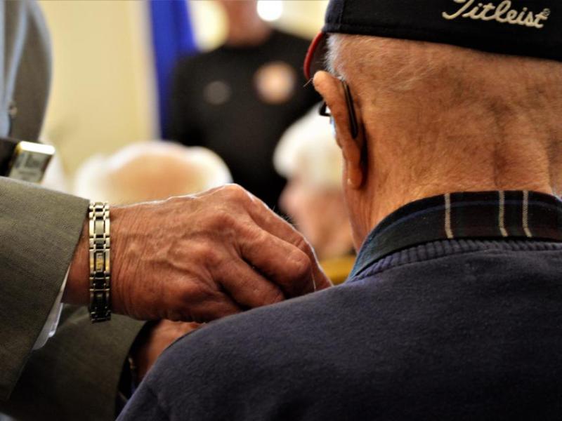 Photo by Brett Fisher. A senior military veteran is recognized at a ceremony hosted by the Nevada Dept. of Veterans Services.