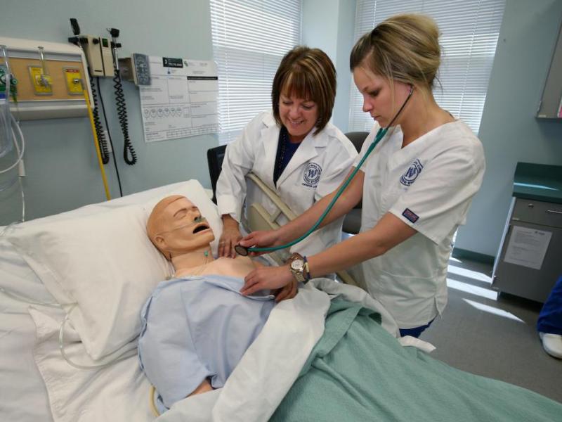 Lisa Dunkelberg watches nursing student Lisa Pourde during exercises in the nursing lab at Western Nevada College.