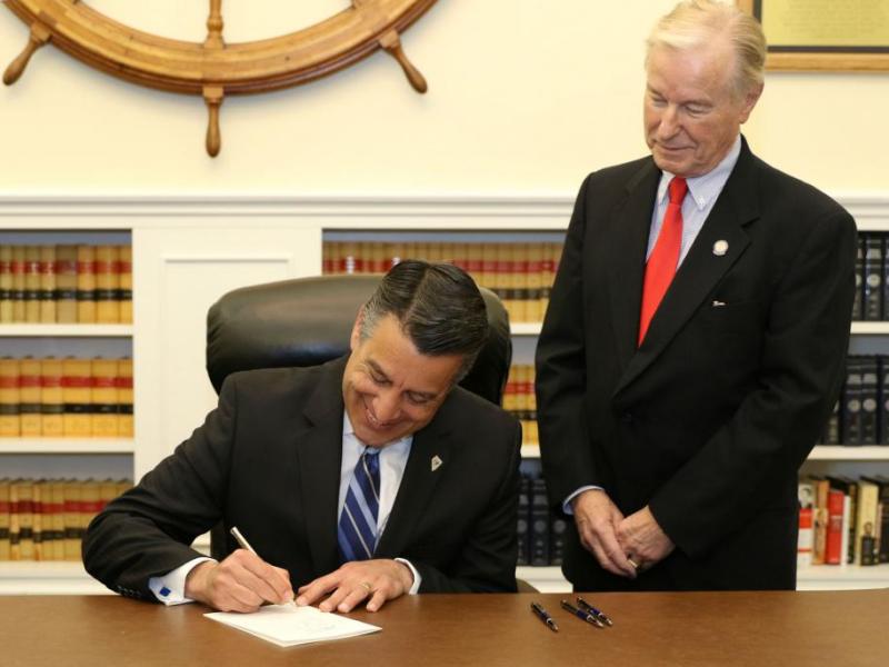 Governor Brian Sandoval and Senator David Parks.