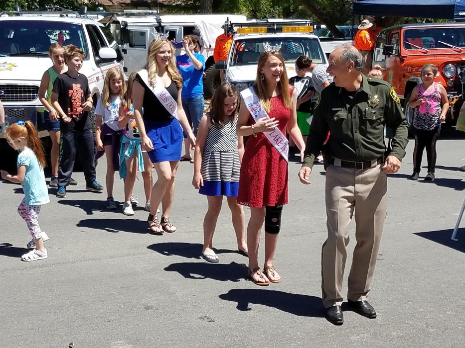 Photos by Brett Fisher. Carson City Sheriff Ken Furlong, Miss Lake Tahoe and Miss Douglas County dance with children Saturday.