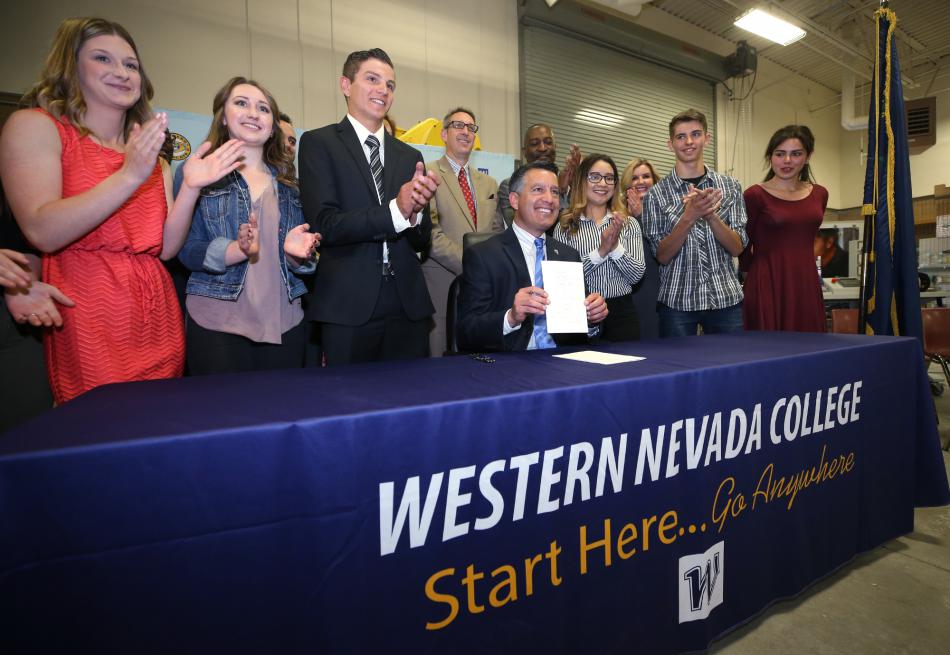 Gov. Sandoval signs the legislation Wednesday at Western Nevada College. Cathleen Allison, Nevada Photo Source