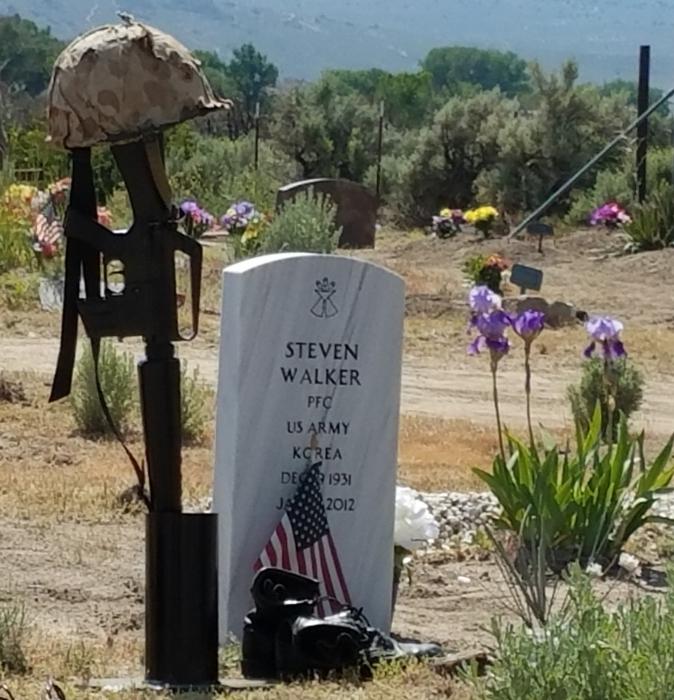 A veteran's grave is decorated Monday at the Stewart Indian Cemetery.