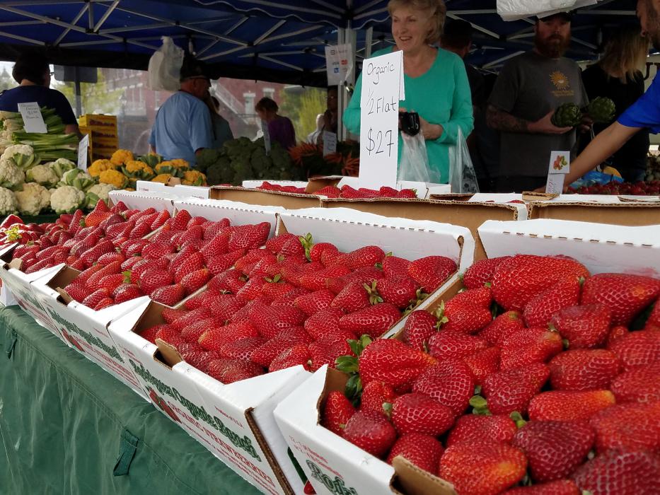 Photos by Brett Fisher. Fresh strawberries Saturday morning at the Third and Curry Farmer's Market.
