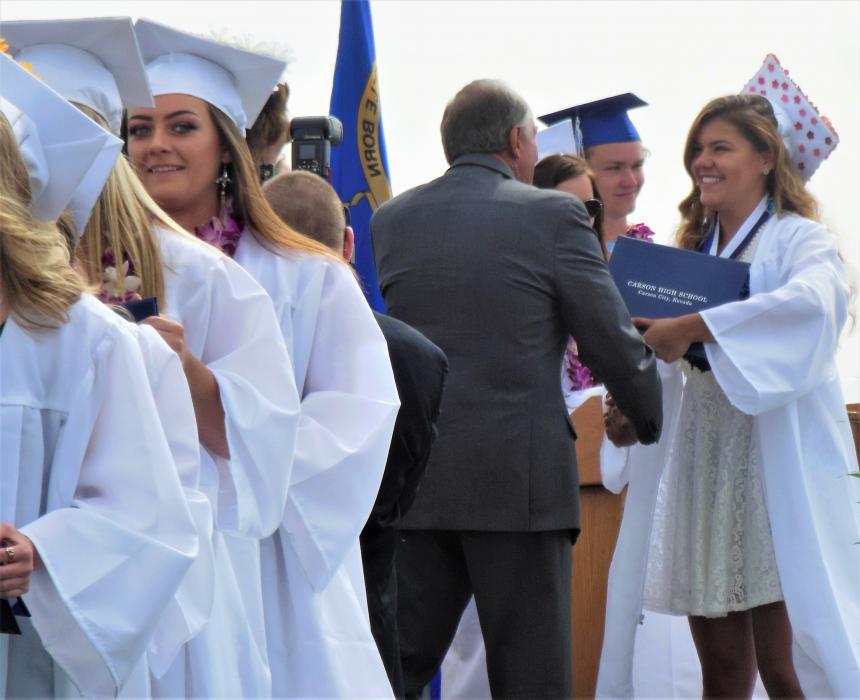 CHS senior Chandler Blueberg receives congratulations along with her diploma.