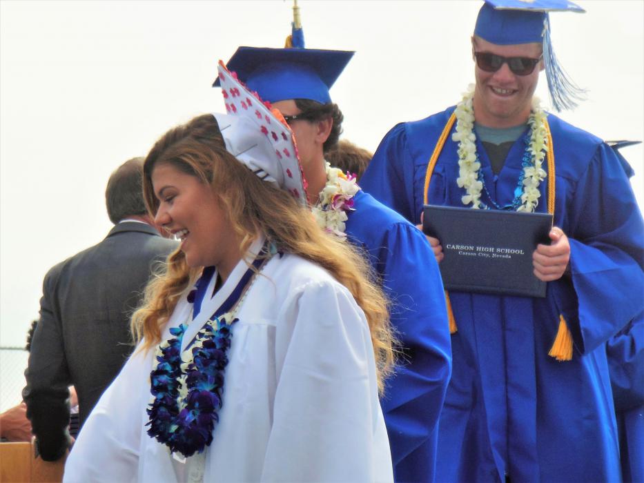 CHS seniors receive their diplomas and congratulations from CCSD administration.