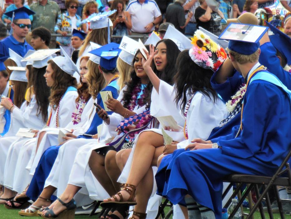 Excited CHS seniors await the start of the graduation ceremony Saturday.