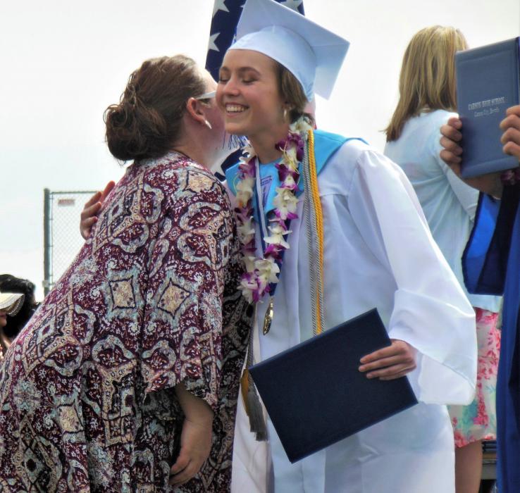 CHS Principal Tasha Fuson hugs a CHS senior coming off stage Saturday.