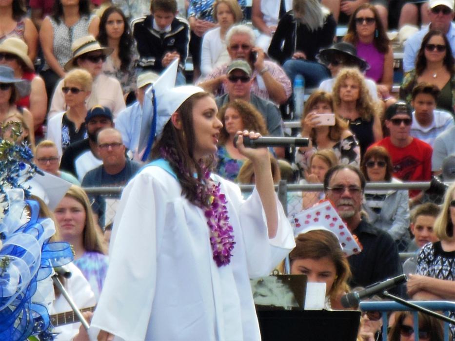 CHS seniors perform the graduation song Saturday before diplomas are handed out.