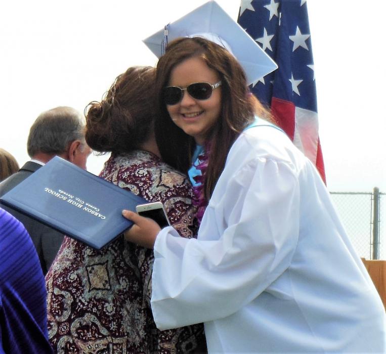 CHS Senior Class President Alyssa Woodward hugs Principal Tasha Fuson.