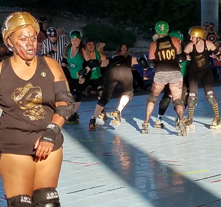 Photos by Brett Fisher. CVR's Shear Terror wears the jammer cap on her helmet on her way around the track for a score Saturday.