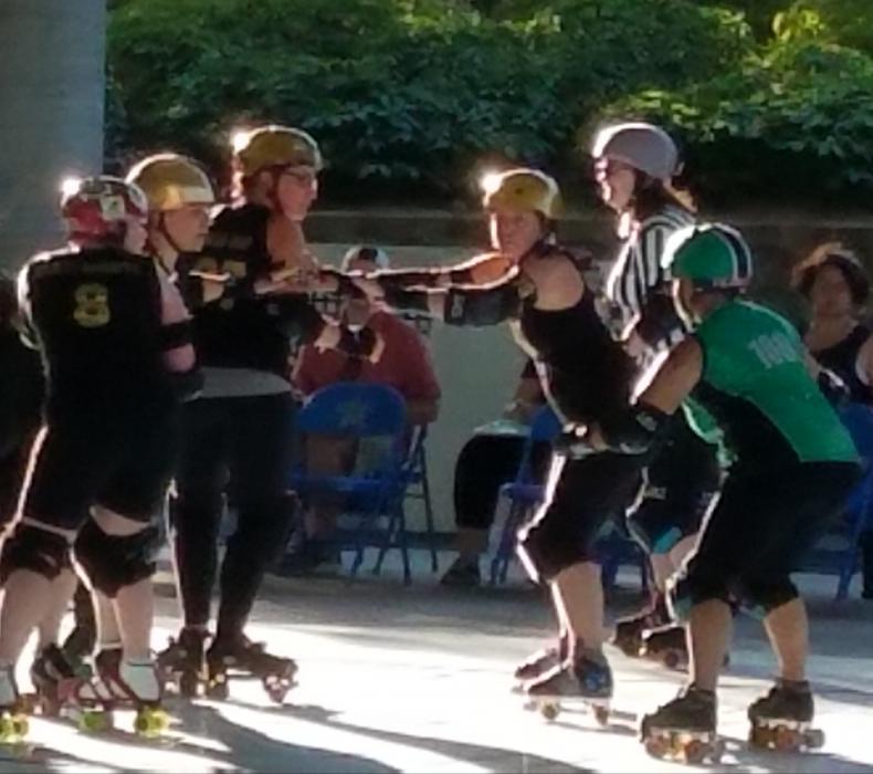 CVR blockers look to stop the Port City jammer from scoring.