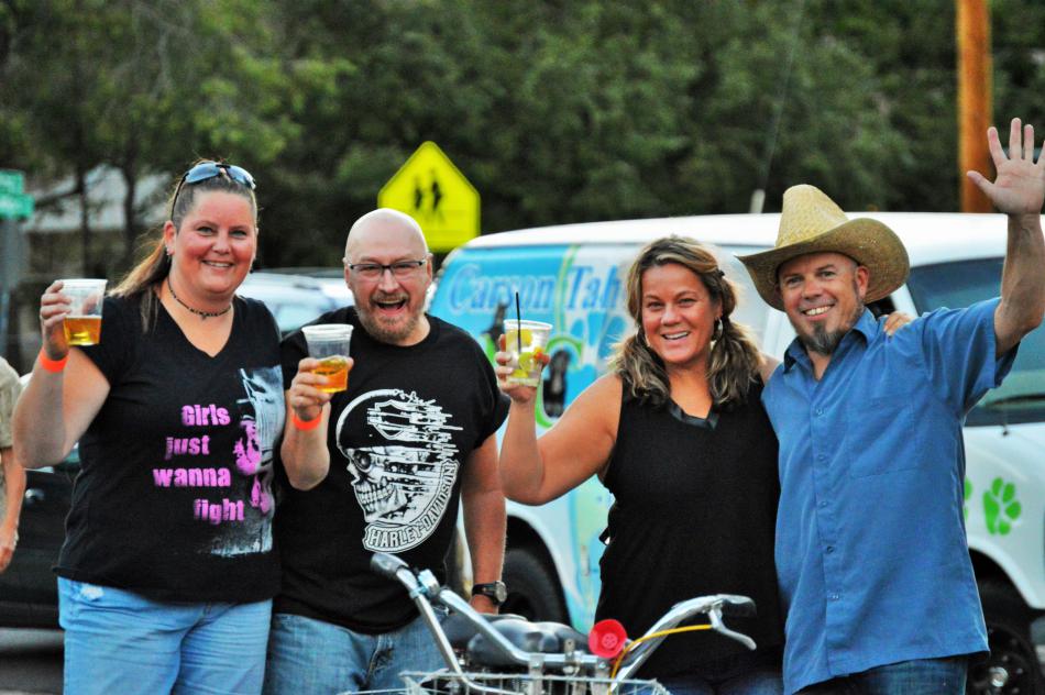 Country music fans are entertained by Southern Drawl Band last summer.