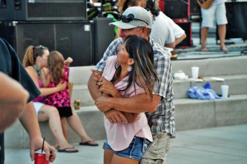 A couple dances to music on the McFadden Plaza at its grand opening last July.