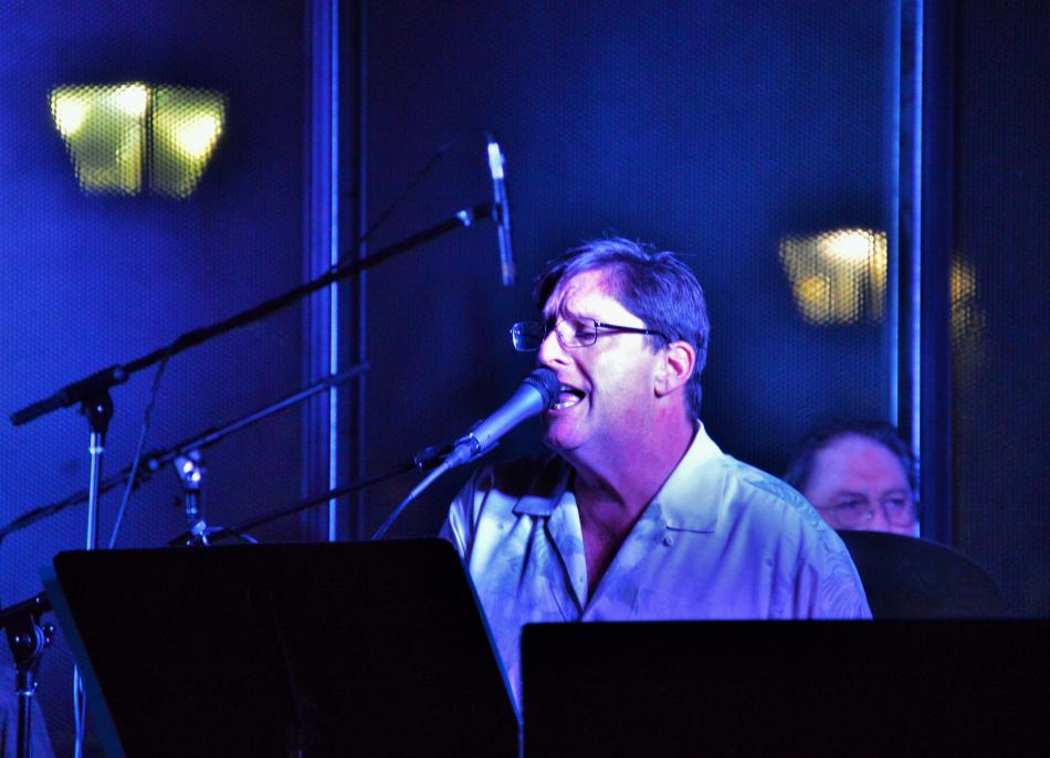 Photos by Brett Fisher. Vocalist-pianist performs on stage at McFadden Plaza in 2016.