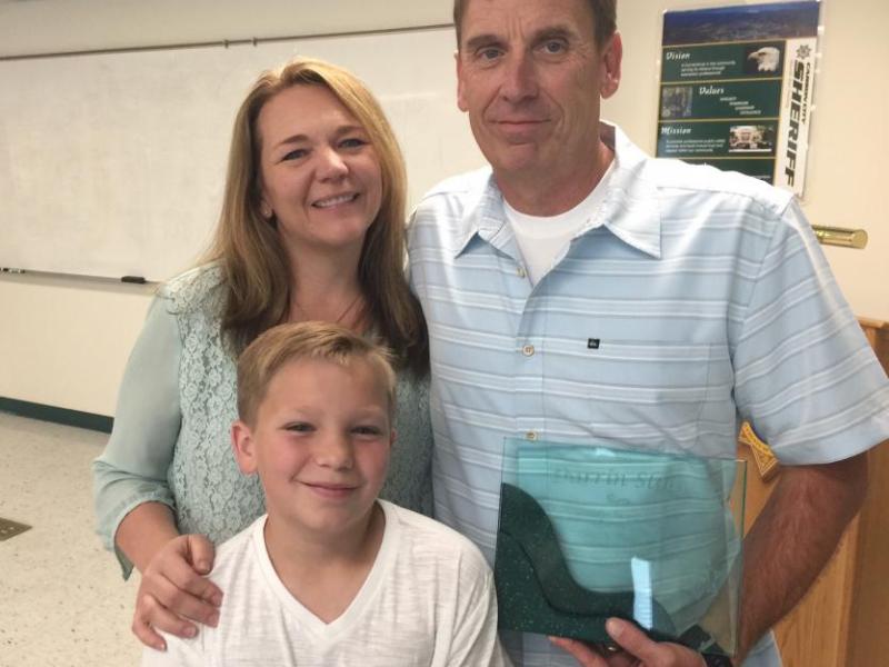 Retiring CCSO Sgt. Darrin Sloan with wife Megan and son Aidan.