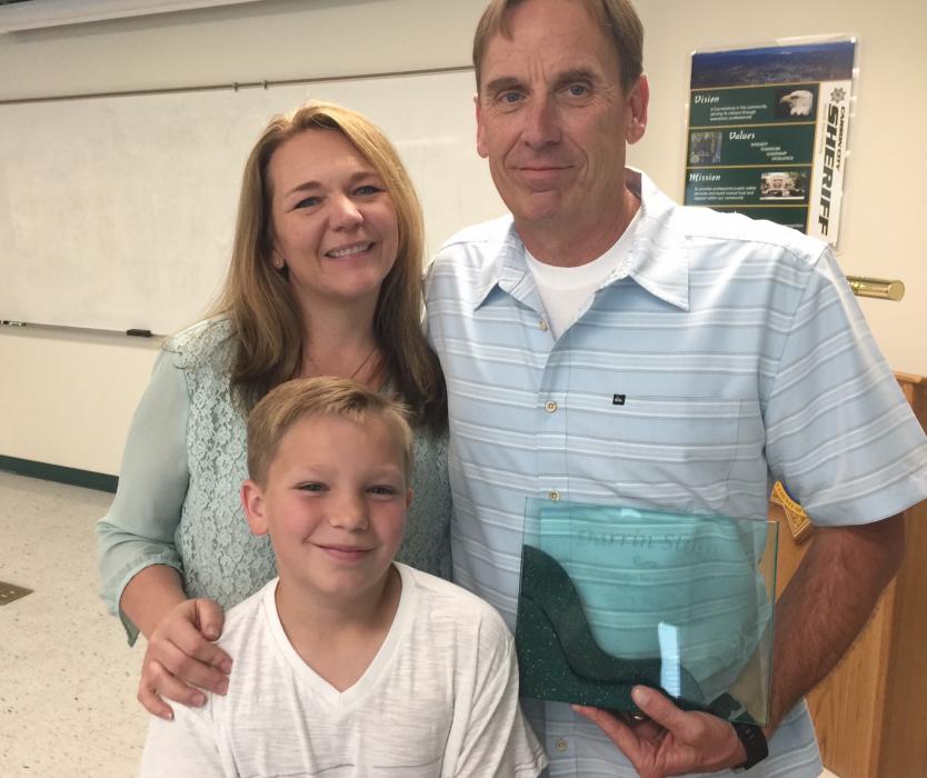 Retiring CCSO Sgt. Darrin Sloan with wife Megan and son Aidan.