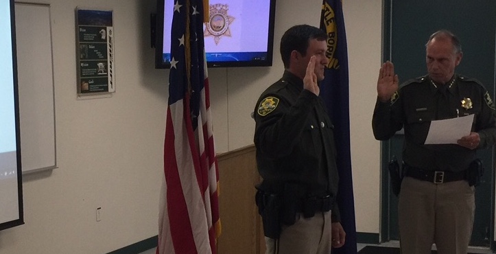 Carson City Sheriff Ken Furlong swears in new Deputy Dylan Etchegaray.
