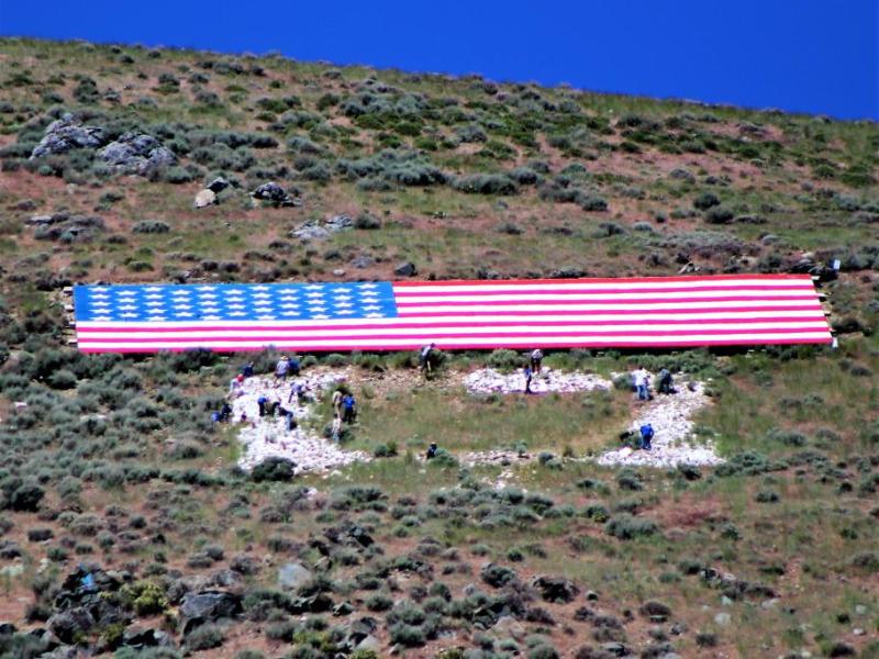 Photo by Brett Fisher. Volunteers work on the C on C Hill Saturday.