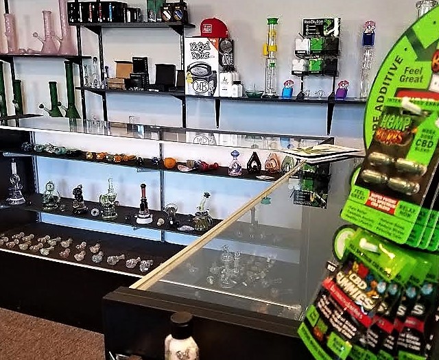 Photo by Brett Fisher. Marijuana concentrate consumables in the foreground.