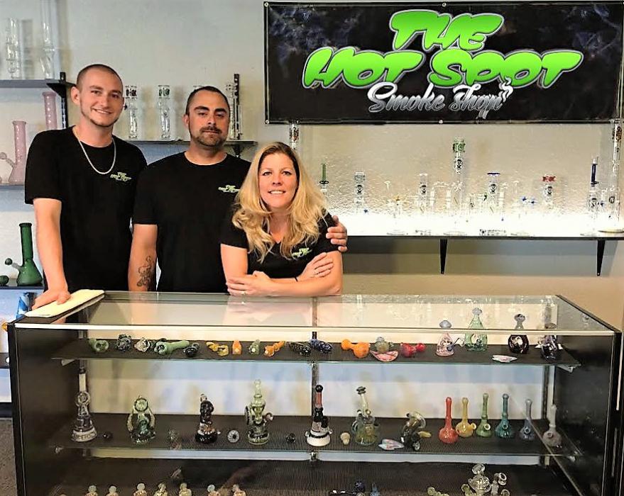 Photo courtesy Hot Spot Smoke Shop. From left: Josh Berry, Vincent and Deanna Congiusti.