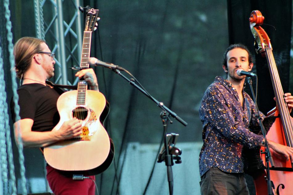 The Novelists' acoustic guitar and bass player jam to a song.
