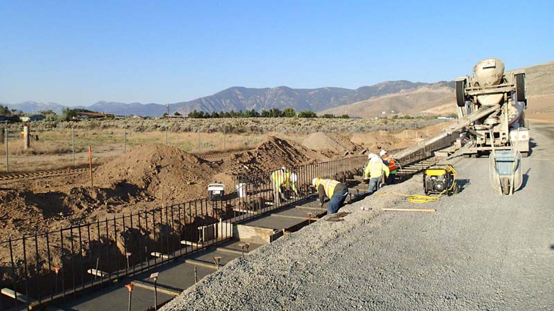 NDOT installs concrete foot for sound walls along the Carson City Freeway. NDOT photo