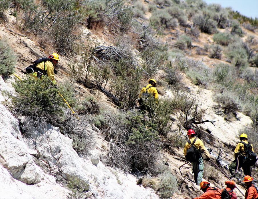 Firefighters mount an attack on the hot spots. Photo by Brett Fisher
