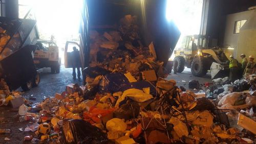 Trash collected at El Dorado Beach being dumped at South Tahoe Refuse. Photo by Ken Curtzwiler.