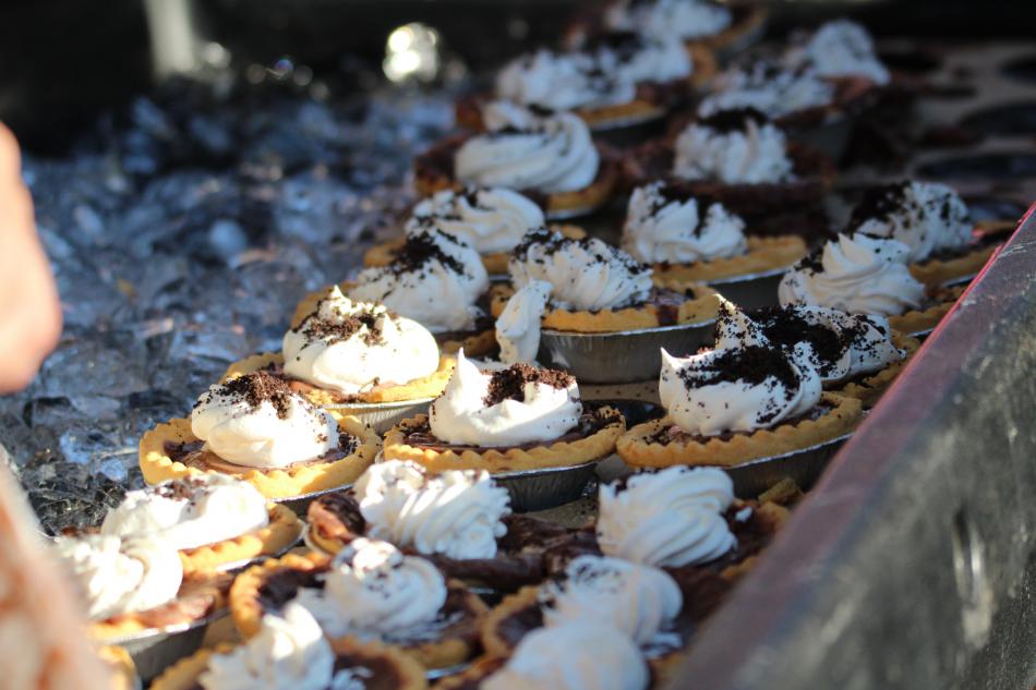 Chocolate desserts topped with whipped cream.