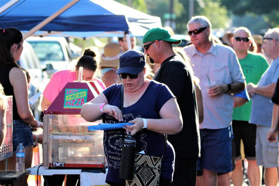 Guests taste Papa Murphy's pizza Saturday at Telegraph Square.
