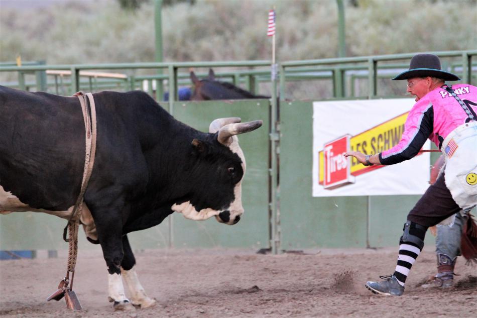 A bullfighter challenges a bull after its rider had been bucked off.