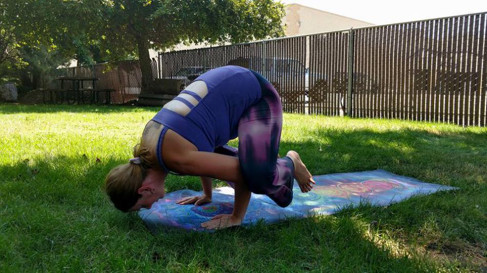 Diane does the yoga pose called Crow at the Carson City Library Sunday.