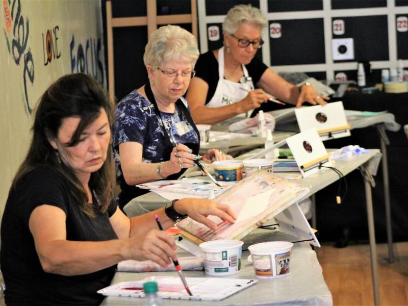 Photos by Brett Fisher. Students in the Artsy Fartsy Creative Center paint with watercolor.
