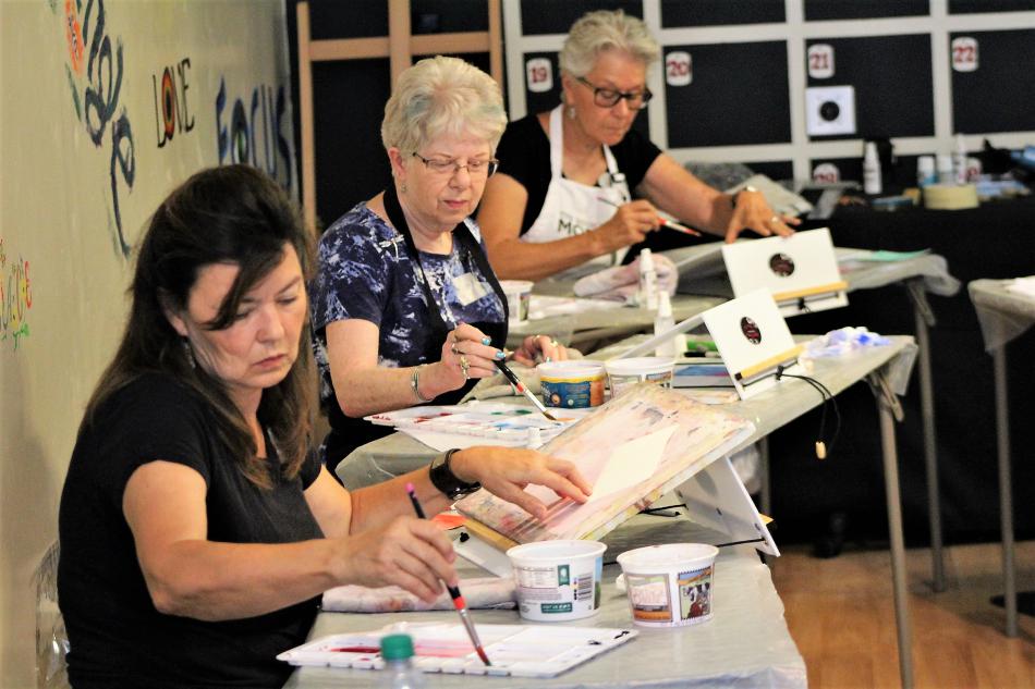 Photos by Brett Fisher. Students in the Artsy Fartsy Creative Center paint with watercolor.