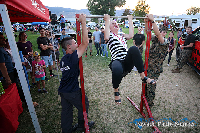 Miss. Douglas County Briana Neben completes a couple chin-ups at the U.S. Marines booth. Cathleen Allison, Nevada Photo Source