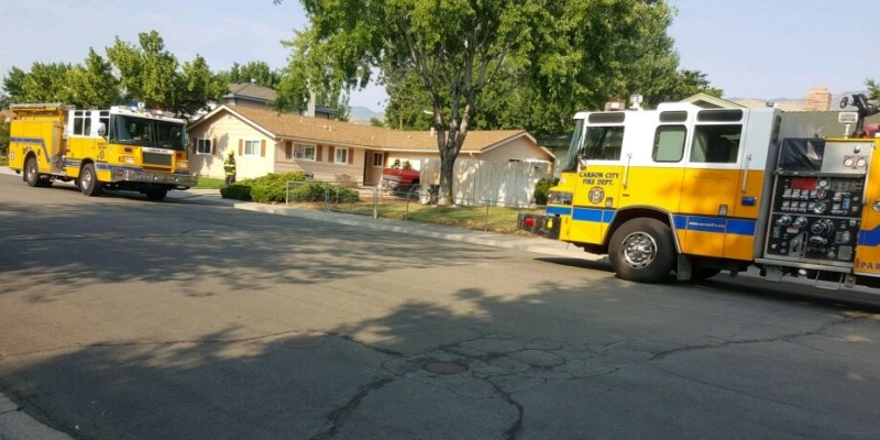 Firefighters knocked down a small fire behind a Baker Street residence. Photo by Isaiah Burrows; second photo frame by CCFD.