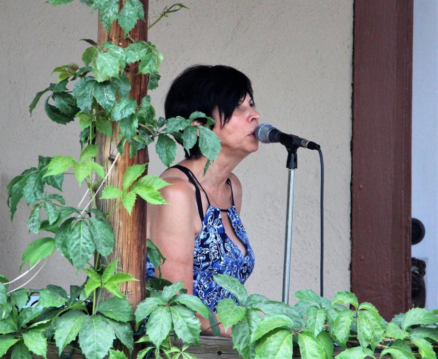 A vocalist performs for guests at Carson City Art Gallery.