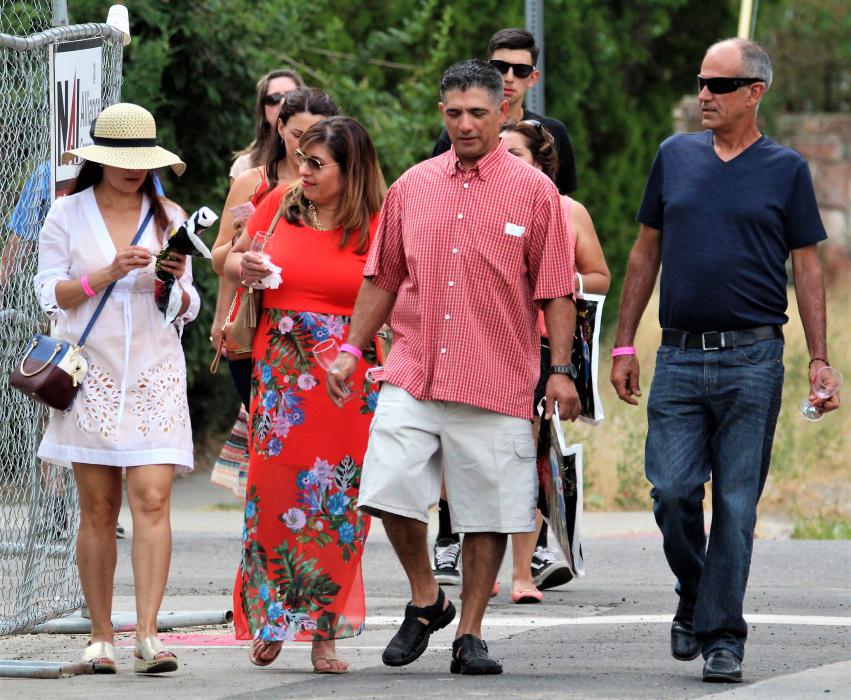 A group of wine walkers make their way to Telegraph Square from Nevada St.