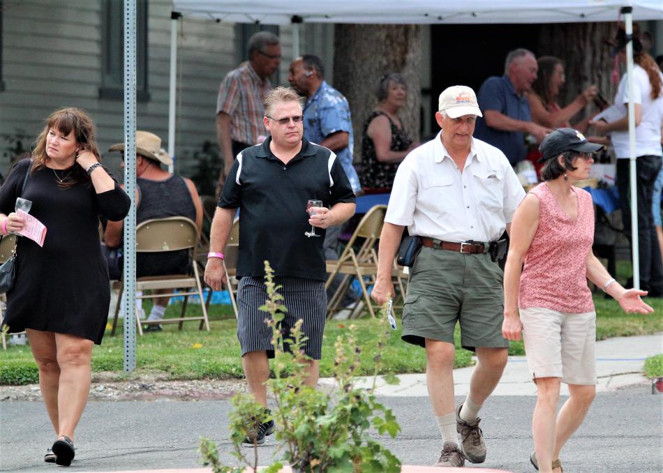 Wine walkers leave the venue at St. Peter's Episcopal Church on Division St.
