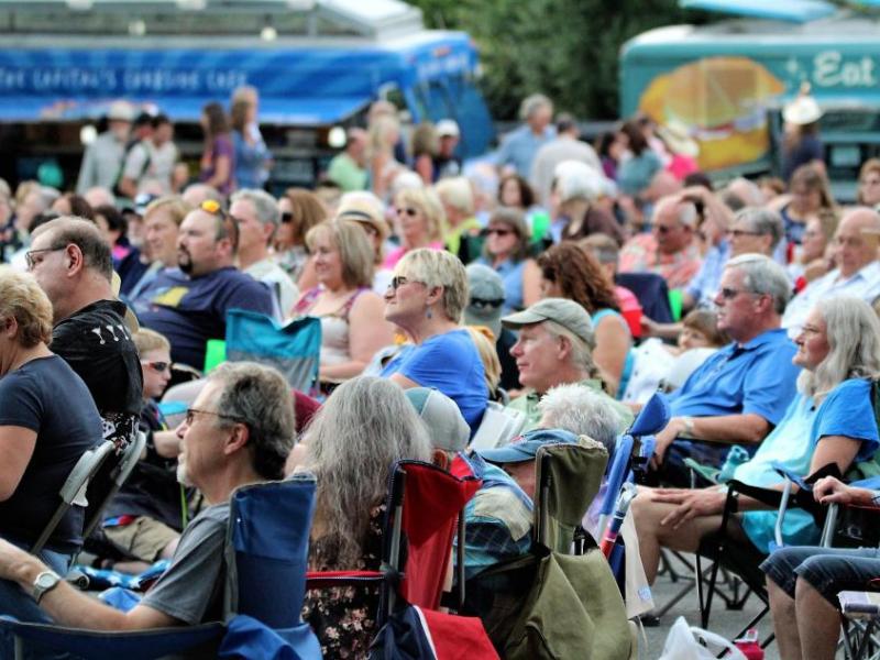 Photo by Brett Fisher. People gather at the Brewery Arts Center's Minnesota Street Stage for an outdoor concert last month.